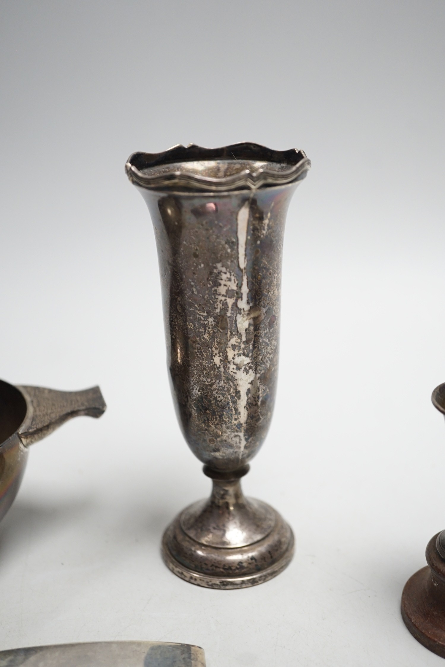 A George V silver two handled bowl, by Sebastian Garrard, London, 1926, 15.5cm, 6.5oz, a silver card case, small silver cup and a Ceylonese white metal posy vase.